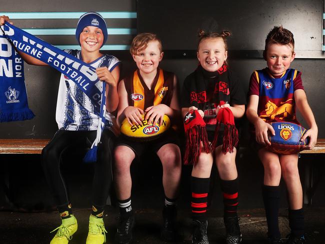 Lindisfarne Junior Football Club members, from left, Riley Sheen, Mitchell Rogers, Scarlette Hall and Harry Robson are ready for the weekend of AFL action in Tasmania. Picture: Nikki Davis-Jones