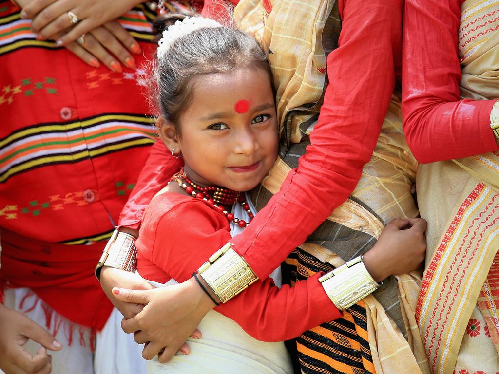 A young girl awaits the arrival of Catherine, Duchess of Cambridge and Prince William, Duke of Cambridge as they visit Pan Bari agricultural village the Mark Shand Foundation in Kaziranga National Park on day 4 of the royal visit to India and Bhutan on April 13, 2016 in Kaziranga, India. Picture: Getty