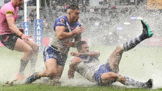 The NRL was played in torrential rain at Bankwest Stadium yesterday. Picture: Getty