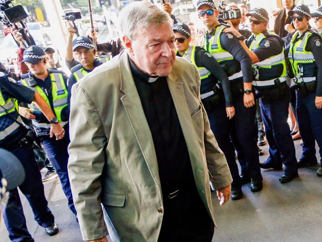 FILE - In this March 5, 2018, file photo, Cardinal George Pell arrives for a hearing at an Australian court in Melbourne, Australia. A lawyer for the most senior Vatican official ever charged in the Catholic Church sex abuse crisis told the Australian court on Tuesday, April 17, 2018 that Pell could have been targeted with false accusations to punish him for the crimes of other clerics. (AP Photo/Asanka Brendon Ratnayake, File)