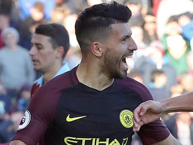 Manchester City's Sergio Aguero, left, celebrates with teammate Nolito after scoring against Burnley during the English Premier League soccer match at Turf Moor, Burnley, England, Saturday Nov. 26, 2016. (Martin Rickett/PA via AP)