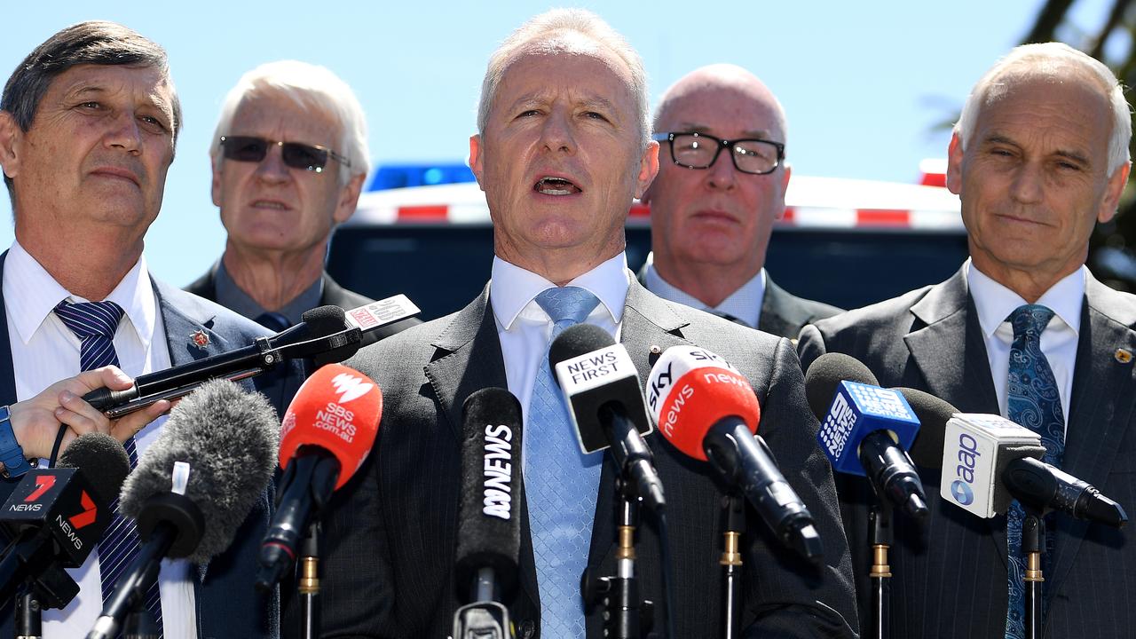 Former NSW Fire and Rescue commissioner Greg Mullins (centre) along with former emergency services chiefs urging the federal and state governments to declare a climate emergency. Picture: Dan Himbrechts/AAP