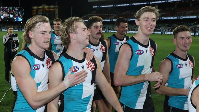 ADELAIDE, AUSTRALIA – AUGUST 13: Miles Bergman of the Power with Jason Horne-Francis after the win during the 2023 AFL Round 22 match between the Port Adelaide Power and the GWS GIANTS at Adelaide Oval on August 13, 2023 in Adelaide, Australia. (Photo by Sarah Reed/AFL Photos via Getty Images)