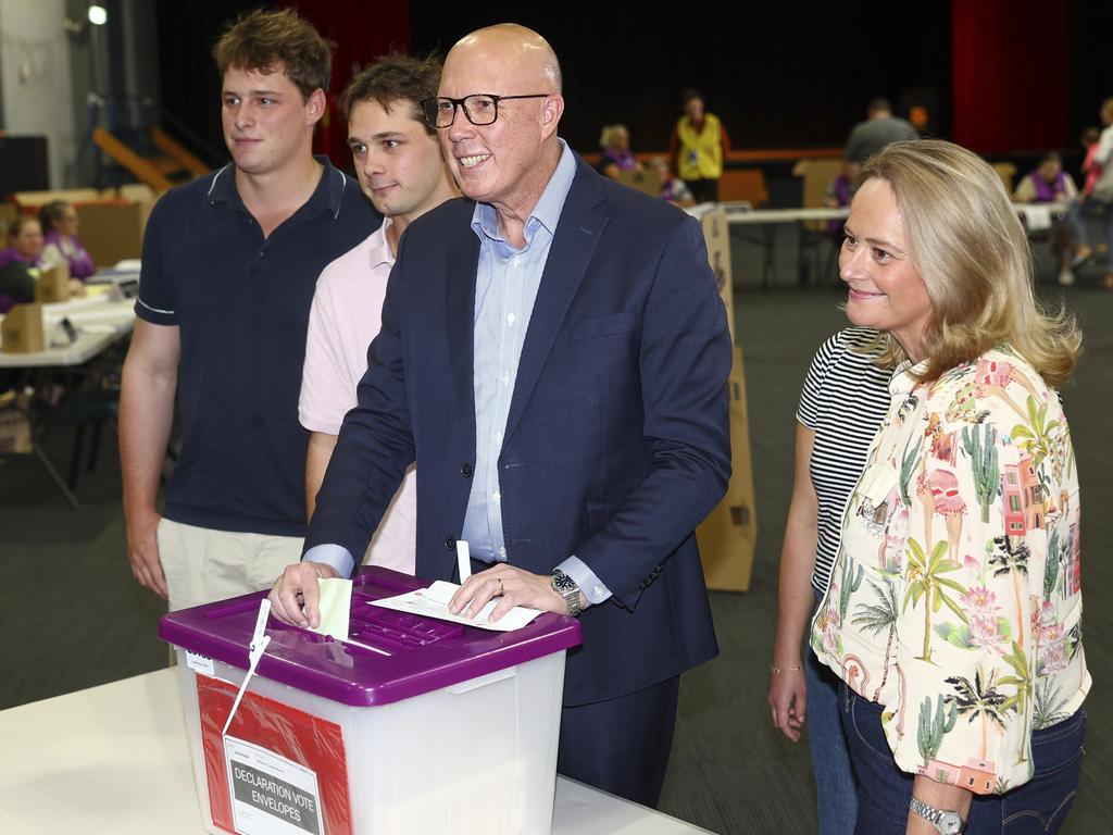 Australian Liberal Party leader Peter Dutton stands with his sons, Tom and Harry and his wife Kirilly as he votes in his electorate in Brisbane. Picture: AP Photo/Pat Hoelscher