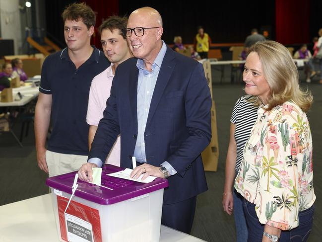 Australian Liberal Party leader Peter Dutton stands with his sons, Tom and Harry and his wife Kirilly as he votes in his electorate in Brisbane. Picture: AP Photo/Pat Hoelscher