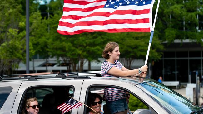 People protest from vehicles against the US government’s closure of non-essential services. Picture: Getty Images