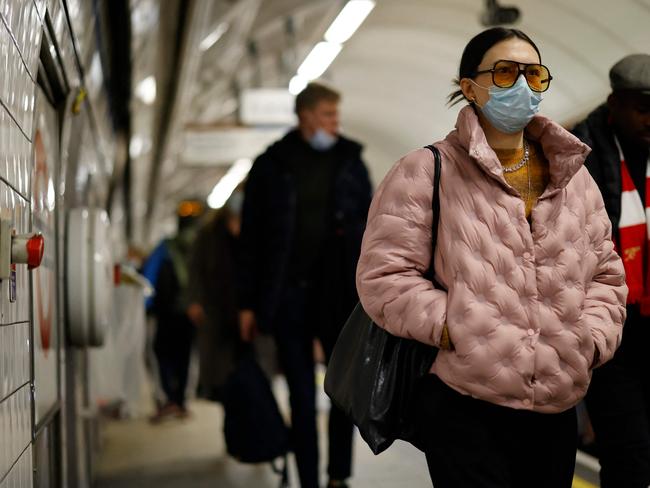 A commuter wearing a face mask leaves the Oxford Circus tube station in London. Virus cases in England are up again. Picture: AFP