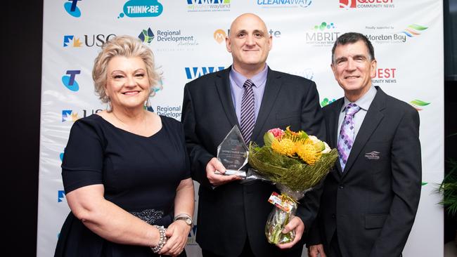 RDA Moreton Bay director Nette Griggs, Solar Bollard Lighting’s Mike Arieni and deputy mayor Mike Charlton. Picture: Dominika Lis