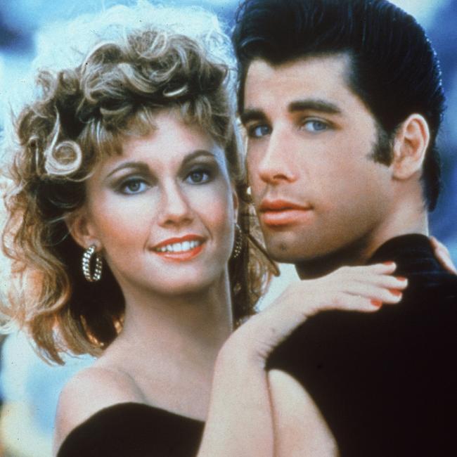 Actors John Travolta and Olivia Newton-John embrace in a promotional still for the film, Grease (Photo by Paramount Pictures/Fotos International/Getty Images)