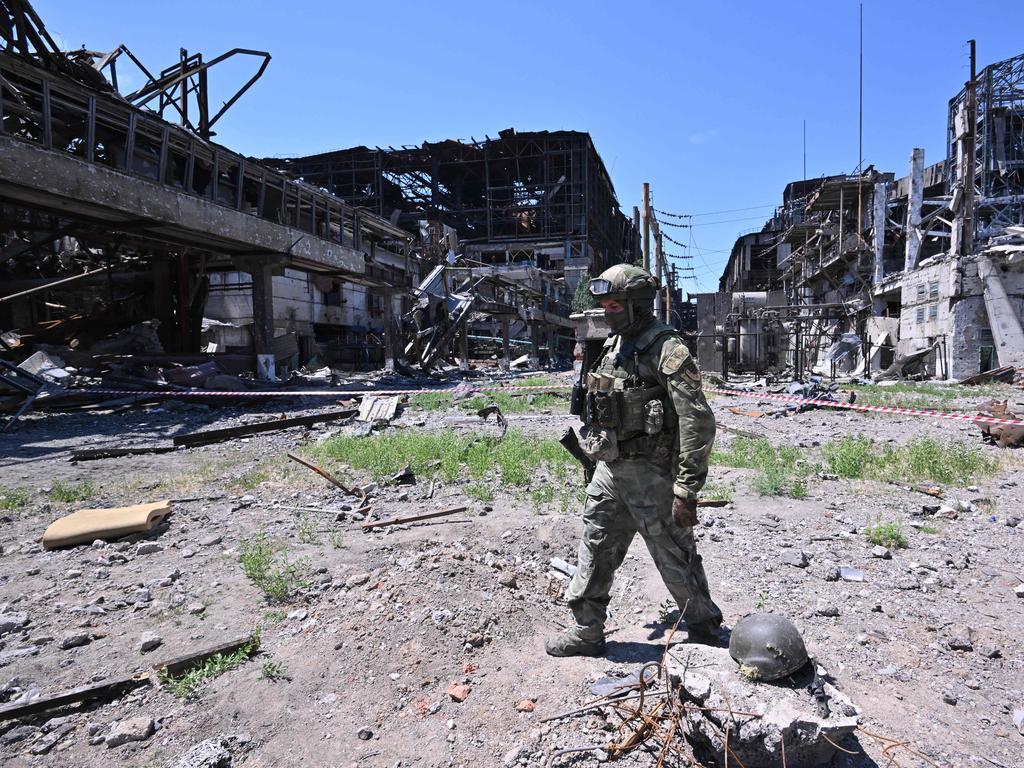 A Russian serviceman stands guard near the Azovstal steel plant in Mariupol, amid the ongoing Russian military action in Ukraine, on June 13, 2022. Picture: Yuri Kadobnov / AFP.