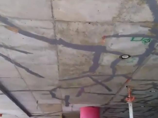 The alarming footage shows extensive cracking across the concrete slab patched with filler.