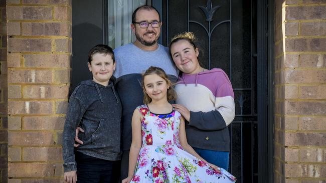 Colin Harrison, with children Jaisaac, 10, Willow, 8, and Piper, 12, purchased his family home using shared equity. Picture: Roy VanDerVegt