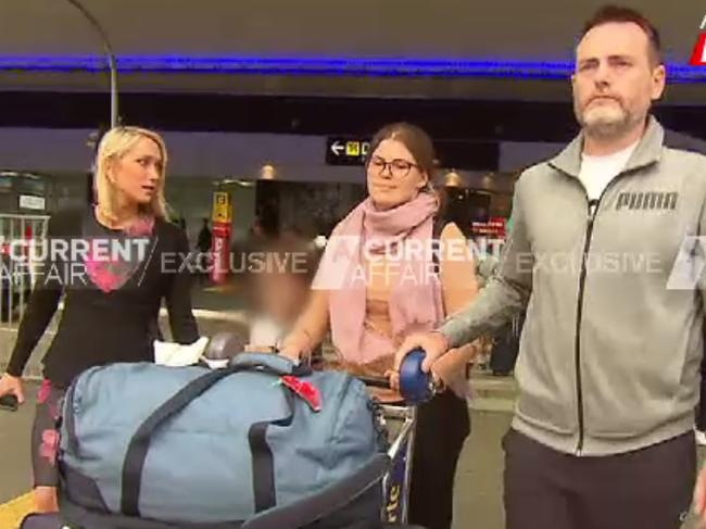 Gibson gets chased out of the airport with her boyfriend. Picture: Channel 9