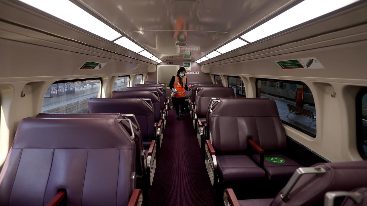 A cleaner walks through an empty train carriage in Sydney. Picture: NCA NewsWire / Dylan Coker