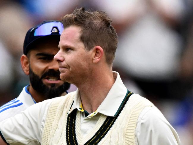 Australia's Steve Smith celebrates reaching his century (100 runs) on the second day of the fourth cricket Test match between Australia and India at the Melbourne Cricket Ground (MCG) in Melbourne on December 27, 2024. (Photo by William WEST / AFP) / -- IMAGE RESTRICTED TO EDITORIAL USE - STRICTLY NO COMMERCIAL USE --