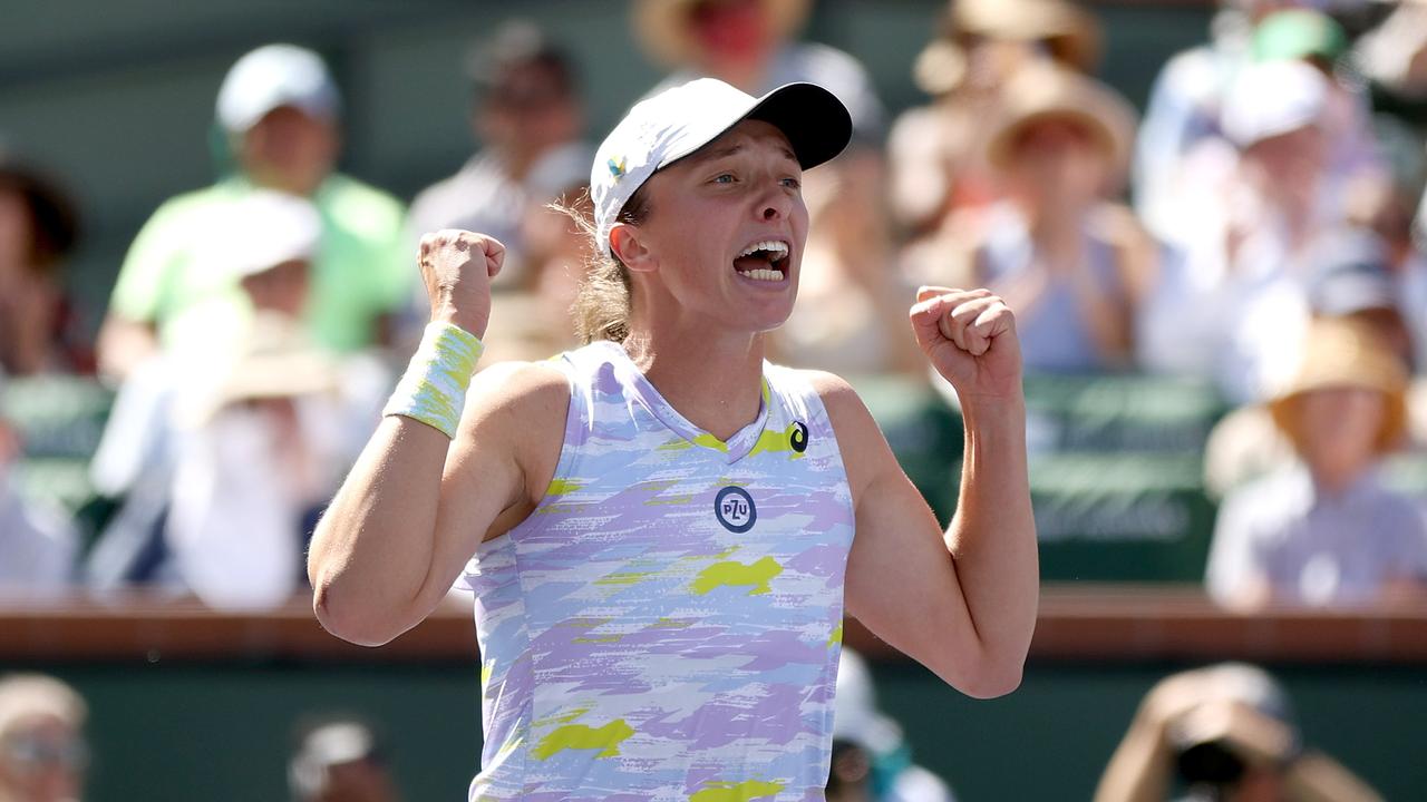 Iga Swiatek of Poland celebrates match point against Maria Sakkari of Greece during the women's final of the BNP Paribas Open at the Indian Wells Tennis Garden.