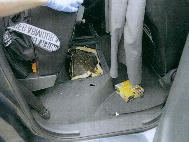 A Louis Vuitton bag containing cash was hidden in his car.