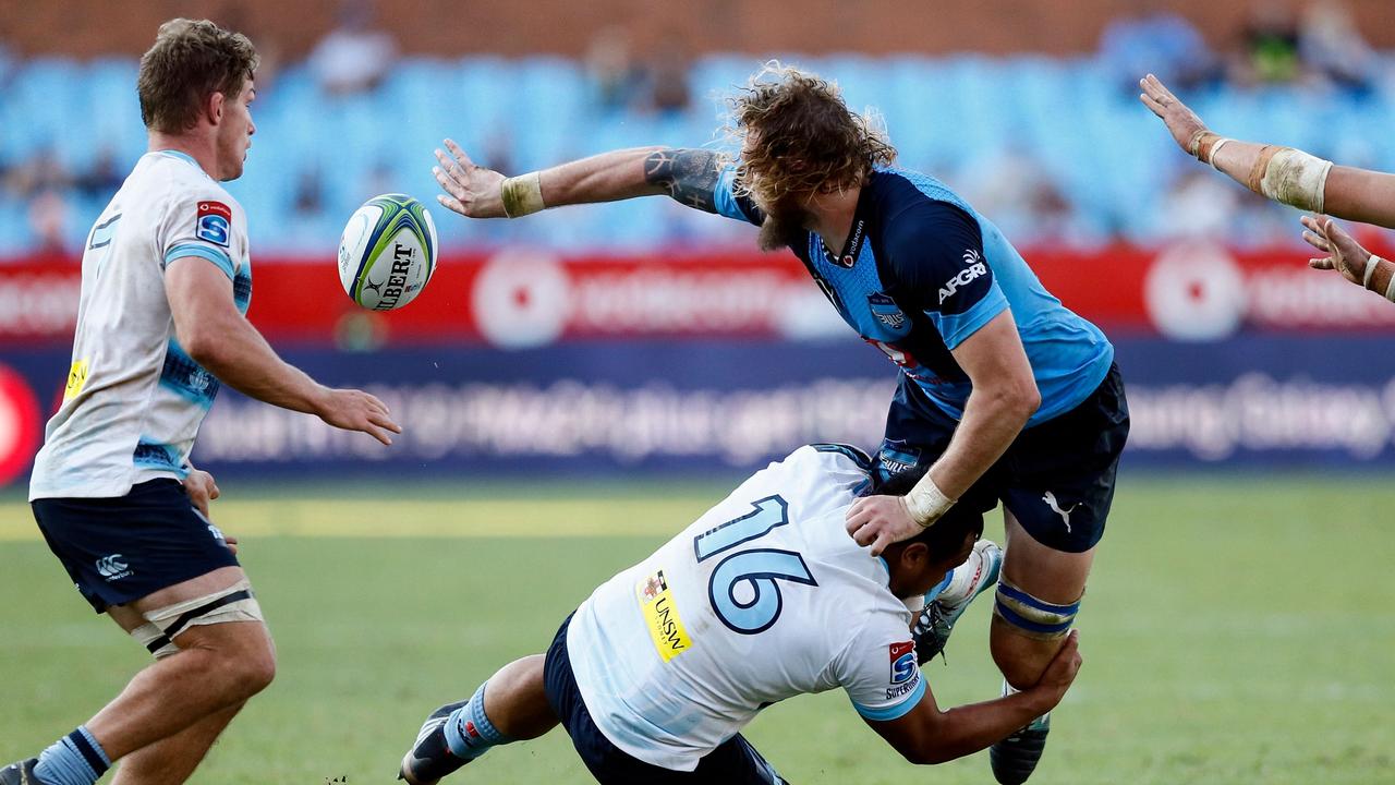 RG Snyman is tackled by Andrew Tuala while Michael Hooper looks on in Pretoria.