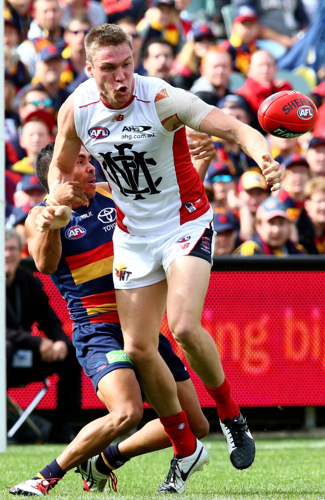 Tom McDonald fends off Eddie Betts at Adelaide Oval. Picture: Sarah Reed