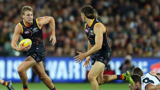 Crows skipper Jordan Dawson runs with Jake Soligo. Picture: Sarah Reed