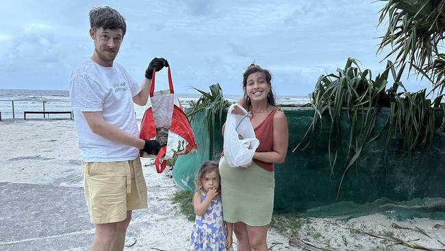 Local family Andy Beecroft, Teddy Beecrooft Ivers and Lucy Ivers clean up Burleigh Beach. Picture: Supplied