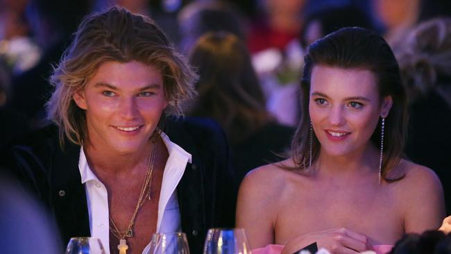 Models Jordan Barrett and Montana Cox sit next to each other at the David Jones Spring/Summer 2017 fashion show in Sydney.