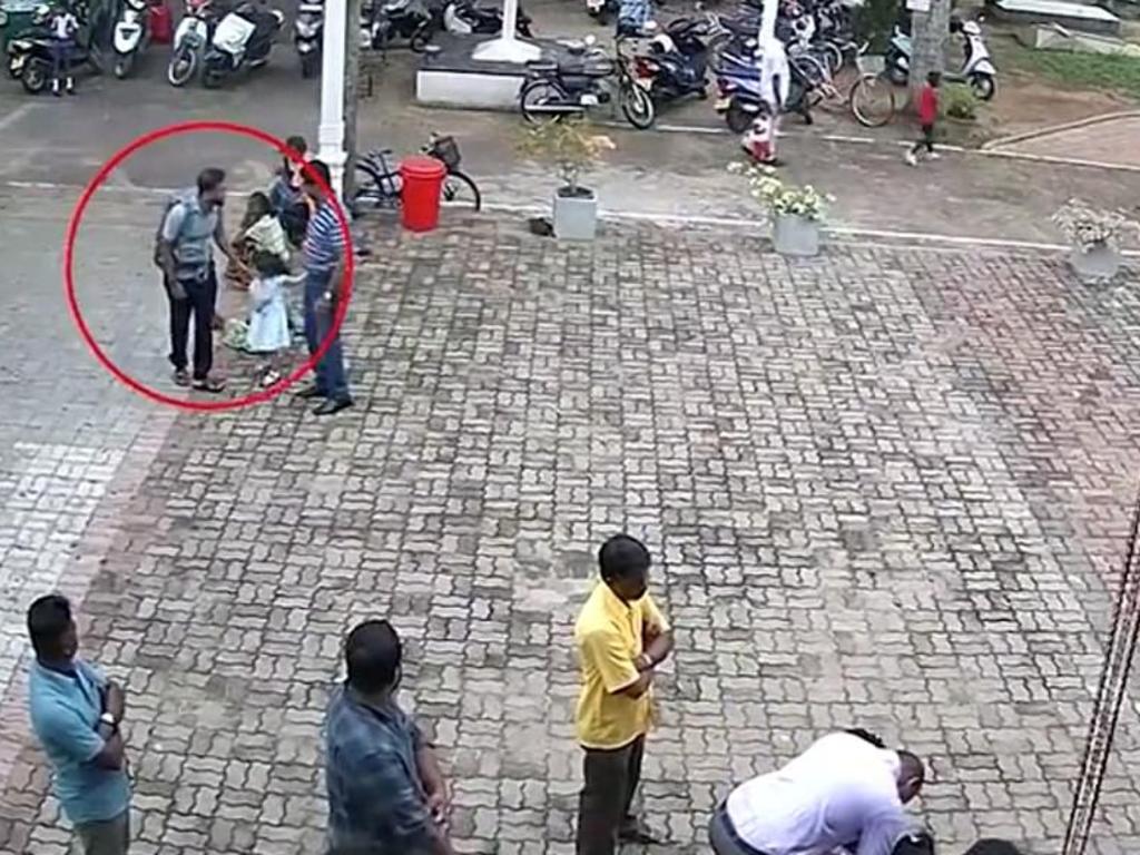 One of the suicide bombers pats a child on the head before bombing St Sebastian’s Church in Negombo. 