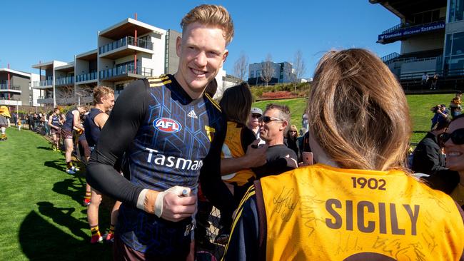 Hawthorn’s James Sicily signs a fan's jumper. Picture: Jay Town