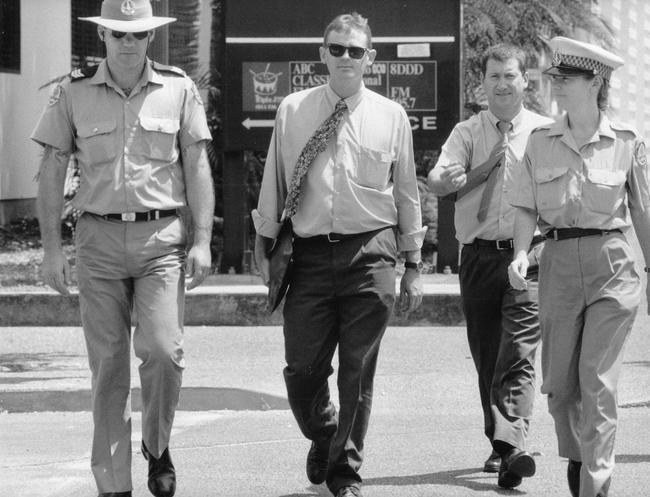 Police witnesses detective Senior Constable Kris Evans and detective Senior Constable Mark Coffey (in plain clothes) leave court in 1996 when Yost was standing trial.