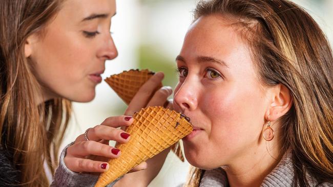 Allie Veall, 21, (right) and Sian Murray, 23, (left) try a coffee in a cone at Europa drive-through coffee shop on Kings Way. Picture: Mark Stewart