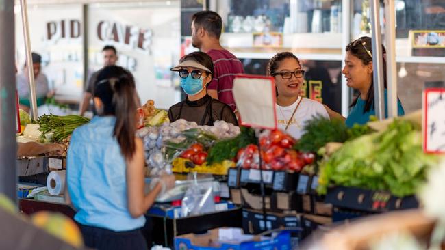 Stallholders back at work at the Rapid Creek markets yesterday. Picture: Che Chorley