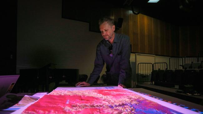 CDU fire information researcher Rohan Fisher demonstrates holographic technology used in bushfires management. Picture: Glenn Campbell