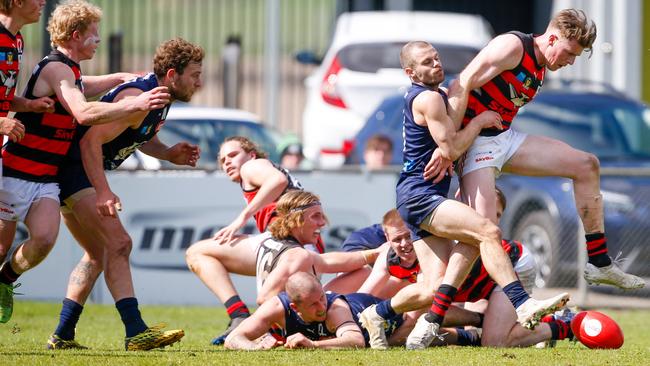 Jay Blackberry applies one of his equal team high five tackles on Lauderdale’s Sam Siggins in their TSL semi-final clash at Windsor Park. Picture: Patrick Gee