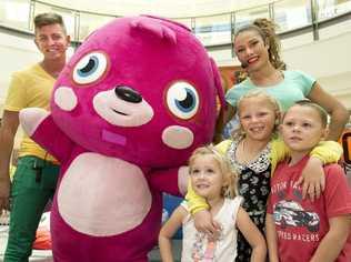 ( back from left ) host Matthew Steven, Poppet the Moshi Monster and host LaToya Saifolio. ( front from left ) Taylah, Chloe and Jake Hatton. Moshi Monster at Grand Central. . Picture: Nev Madsen