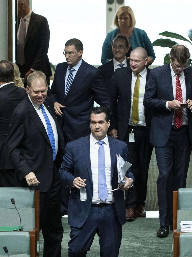 MP's ignore the social distancing rules as they enter the House of Representatives. Picture: Gary Ramage