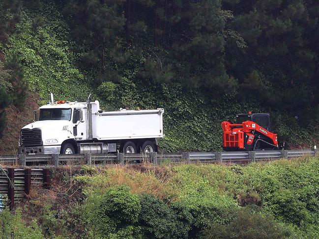 Diggers and trucks working on Deviation Rd from Fyansford to Newtown which is closed closed because of a landslip. Picture: Alison Wynd