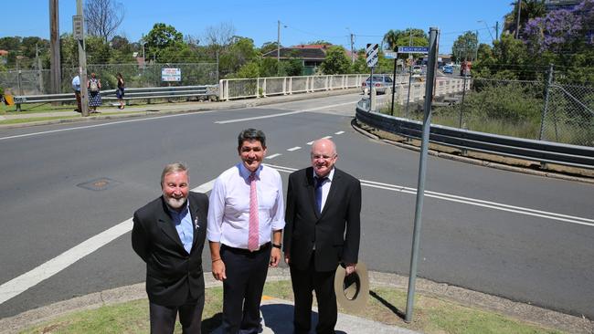 Parramatta and Cumberland mayors, Greg Cummings and Andrew Wilson, flank Parramatta state MP Geoff Lee at the announcement of widening Westmead’s Bridge Rd rail overpass to three lanes in the next year.