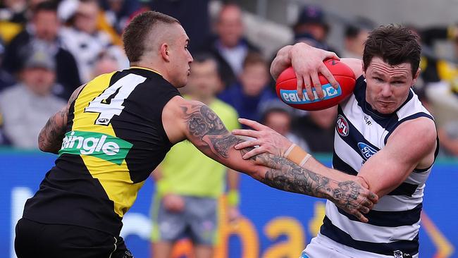 Patrick Dangerfield evades Dustin Martin in the opening term. Pic: Michael Klein