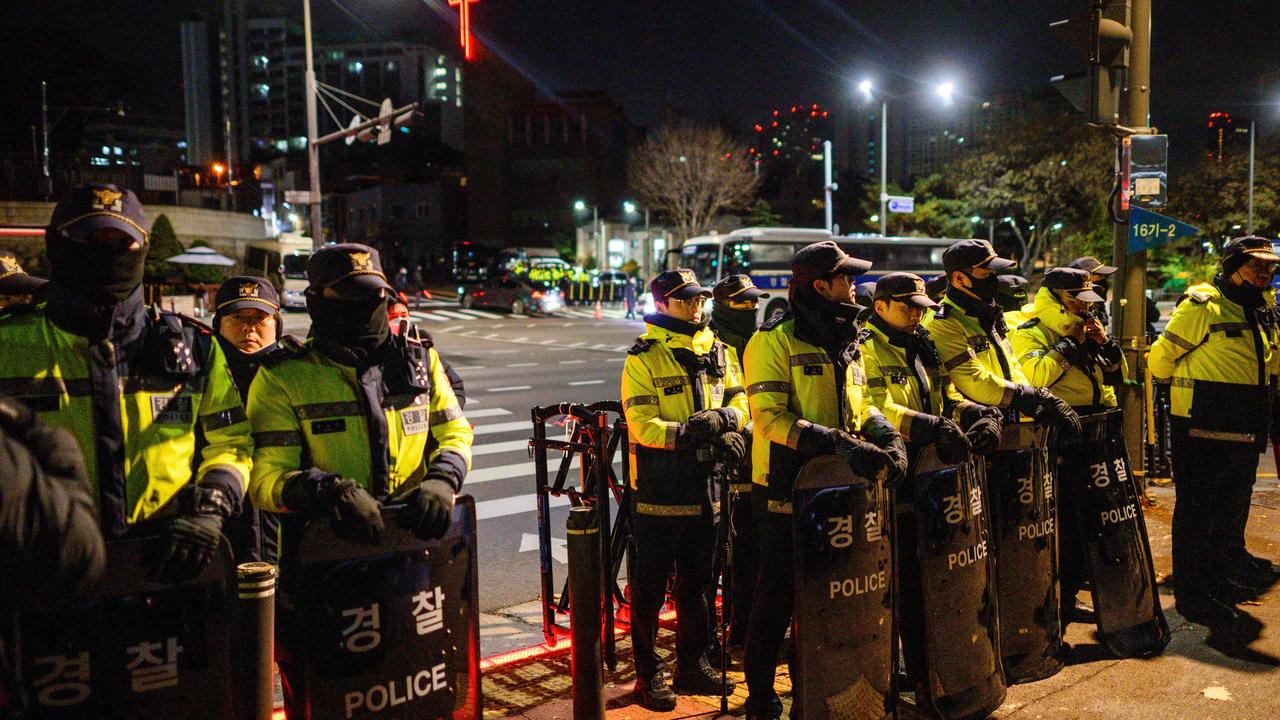 Police stand guard near the South Korean Presidential Office and the Defence Ministry in Seoul, after South Korean President Yoon Suk Yeol declared martial law. Picture: Anthony Wallace/AFP