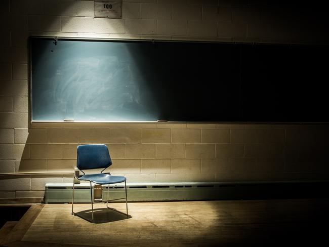 An Empty Chair in a Dark Classroom. Generic classroom, empty classroom, teaching, student, school. Picture: iStock