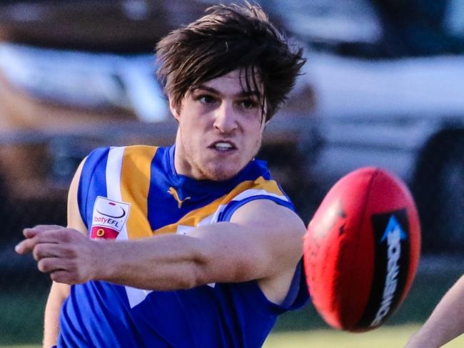 Bailey Stevens gets a kick away for Heathmont against Waverley Blues in the Eastern Football League (EFL). Picture: Chris Mirtschin