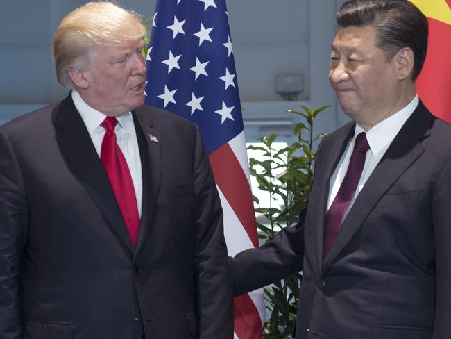 Mr Trump, left, and Chinese President Xi Jinping pictured during a meeting on the sidelines of the G20 Summit in Hamburg, Germany in July. Picture: Saul Loeb/Pool Photo/AP