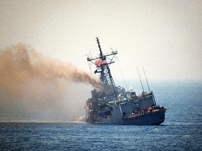 The guided missile frigate USS Stark (FFG-31) listing to port after being hit by two Iraqi Exocet missiles within 30 seconds. 37 sailors are killed.