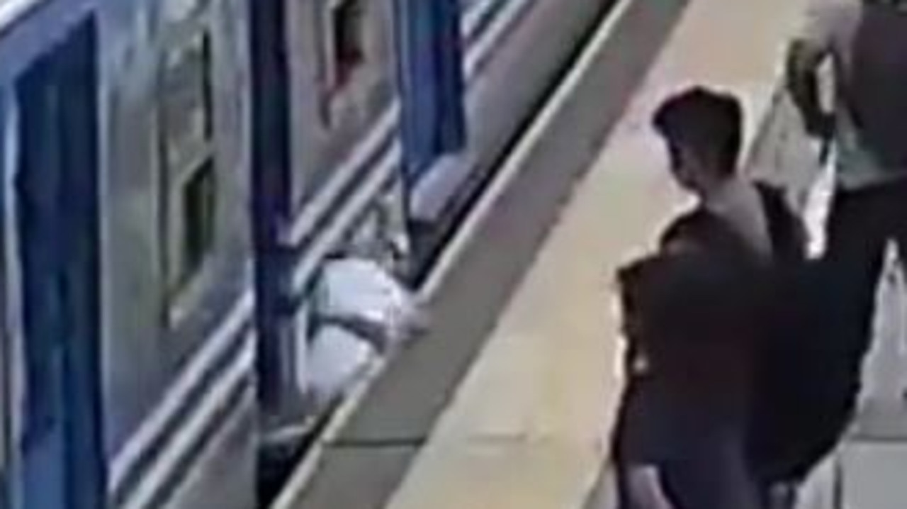 Onlookers were fearing at the worst as she disappeared underneath the train. Picture: YouTube/ El1 Digital.
