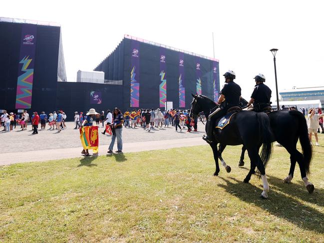 NEW YORK, NEW YORK - JUNE 03: Spectators make their way towards the stadium as Police horses are seen ahead of the ICC Men's T20 Cricket World Cup West Indies & USA 2024 match between Sri Lanka  and South Africa at  Nassau County International Cricket Stadium on June 03, 2024 in New York, New York. (Photo by Robert Cianflone/Getty Images)