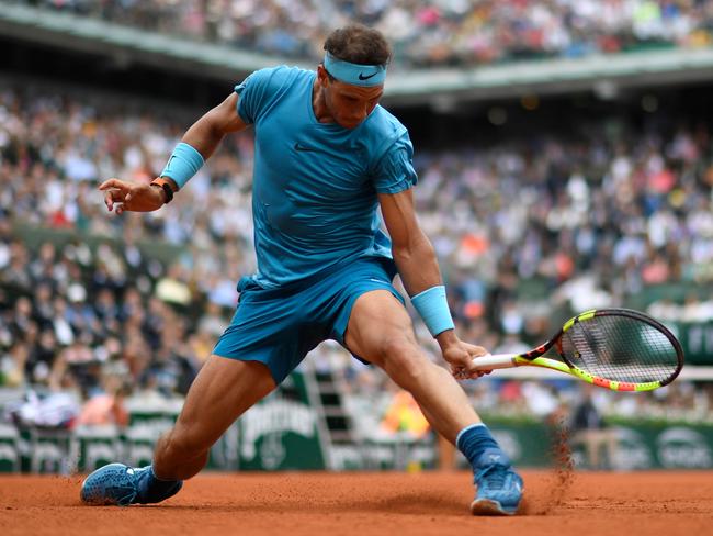 Spain's Rafael Nadal plays a backhand return to Italy's Simone Bolelli during their men's singles first round match on day three of The Roland Garros 2018 French Open.