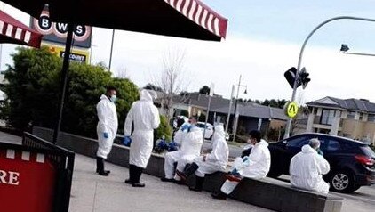 Workers who had been cleaning Bakers Delight in Mernda after a positive coronavirus case, were allegedly seen eating and using their phones while still dressed in protective gear.