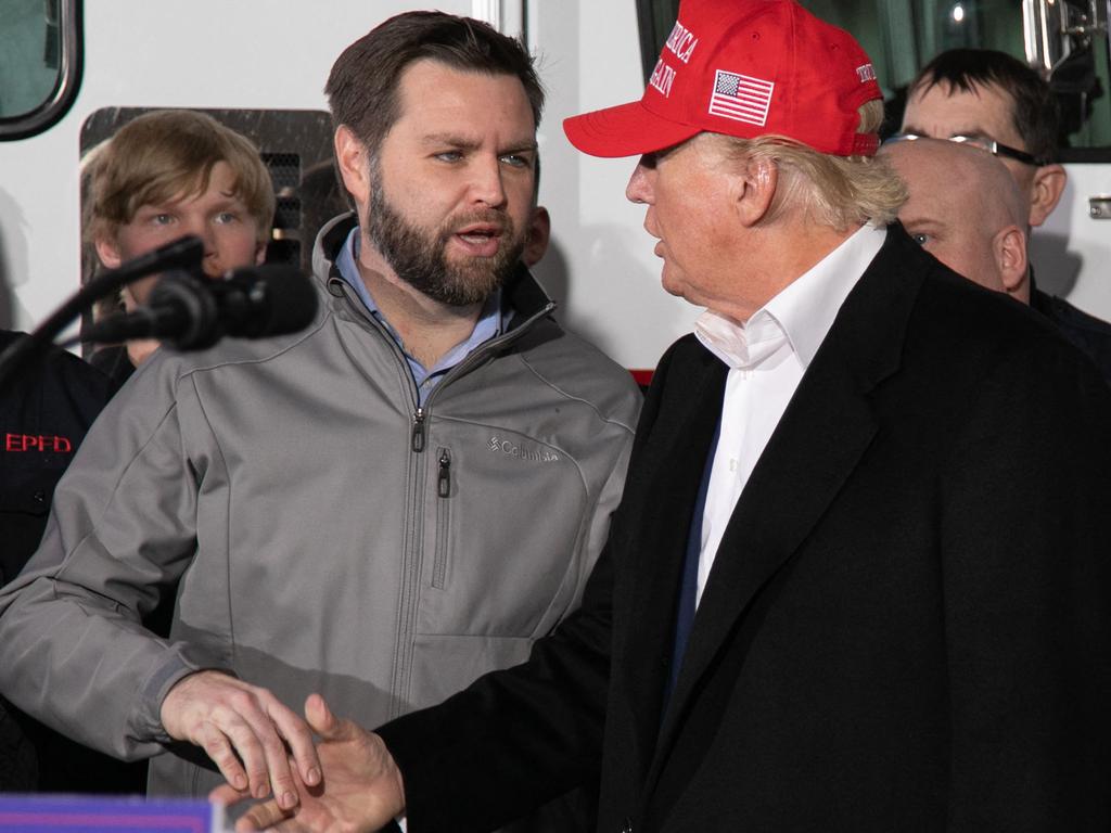 US Senator JD Vance shakes hands with former US President Donald Trump. Picture: AFP