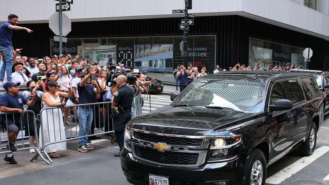 Donald Trump drives by supporters sitting for a deposition in New York. Picture: AFP