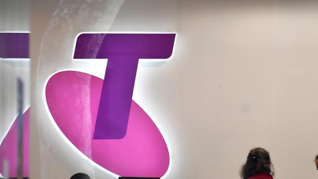 Customers and assistants are seen in a Telstra store in Sydney, Monday, July 8, 2018. Investors hoping to maintain their dividend payments from Telstra might be in for a shock, with Plato Investment Management managing director Don Hanson warning the rivers of gold are over for the telecommunications company. (AAP Image/Mick Tsikas) NO ARCHIVING